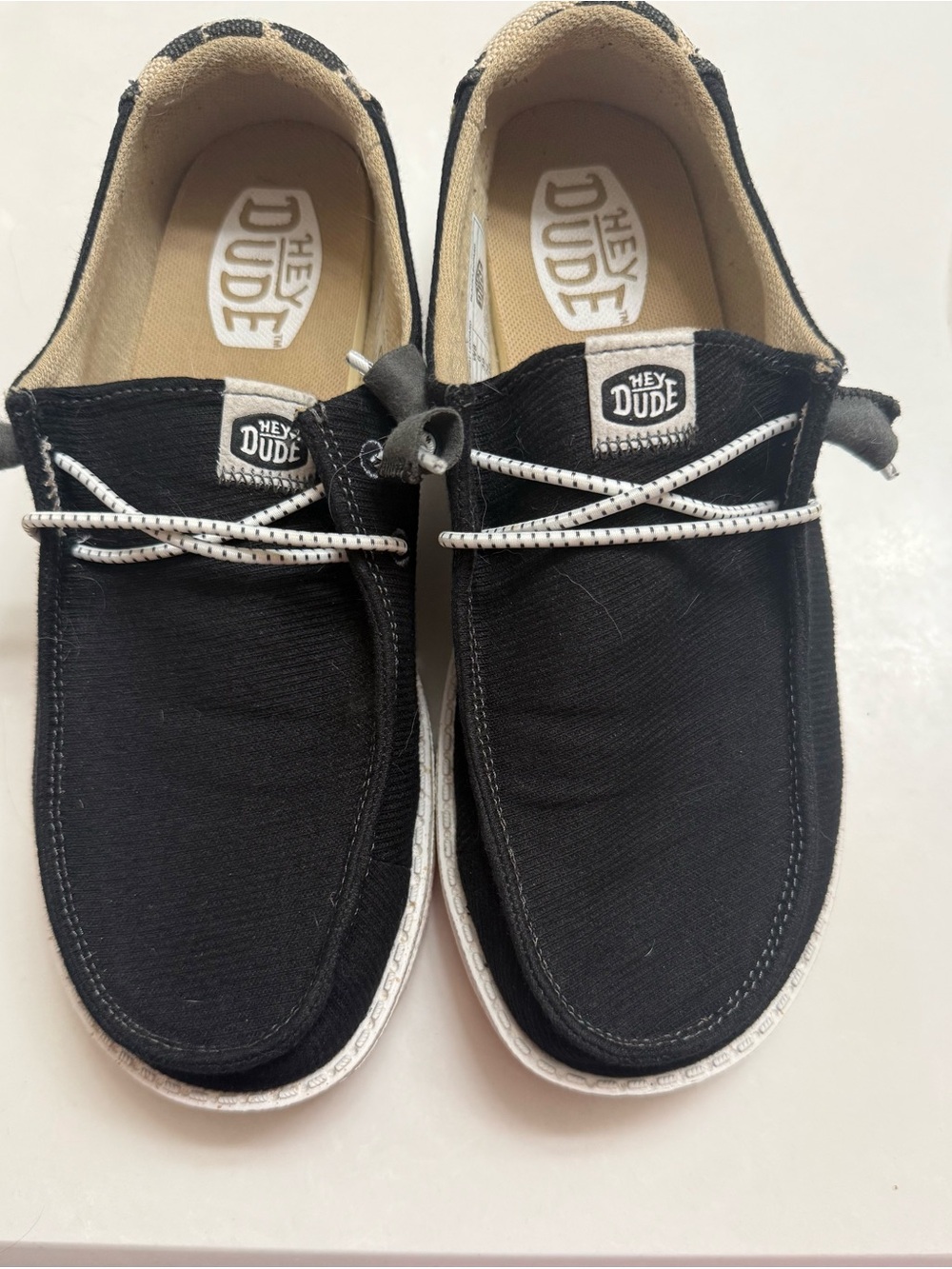 Hey Dude Black Canvas Slip-On Shoes with White Laces and Cow Print Back